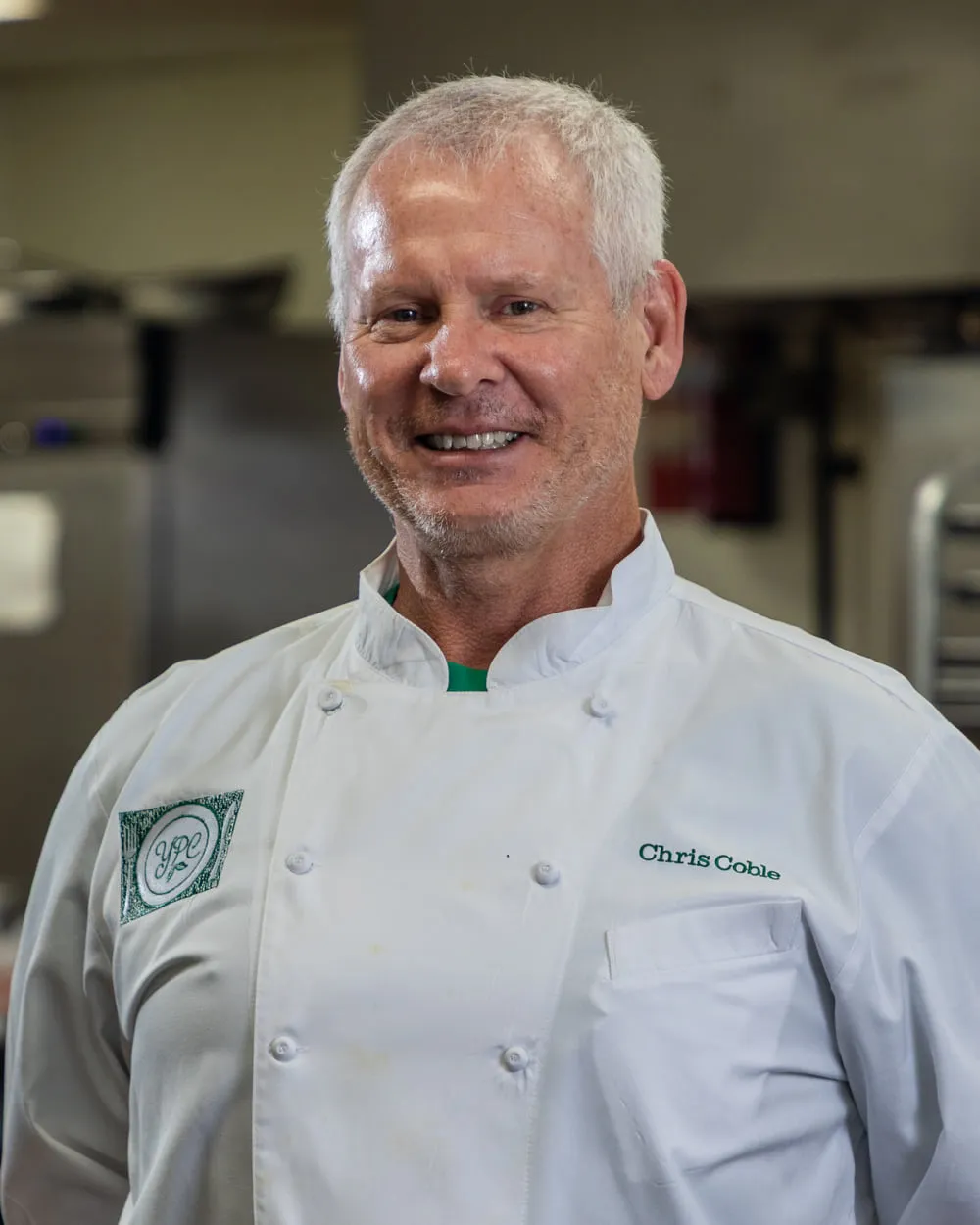 Chef Chris Coble in his chef whites in the YPC Market kitchen
