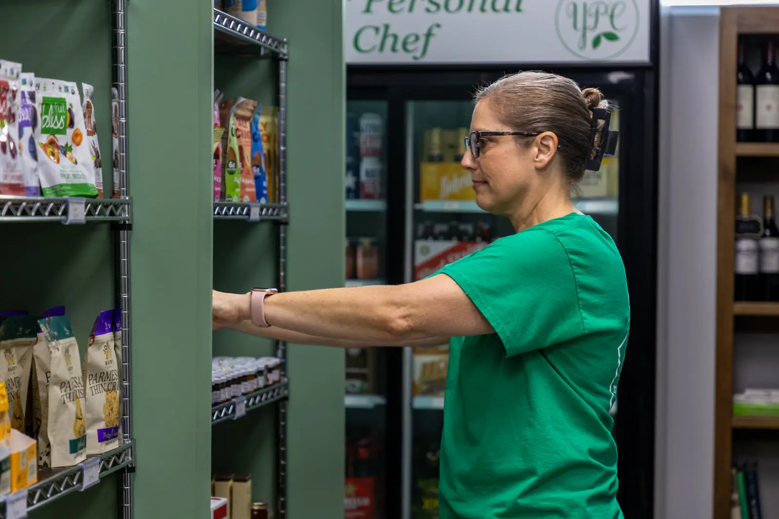 Janet Coble stocking the YPC Everyday pantry shelves