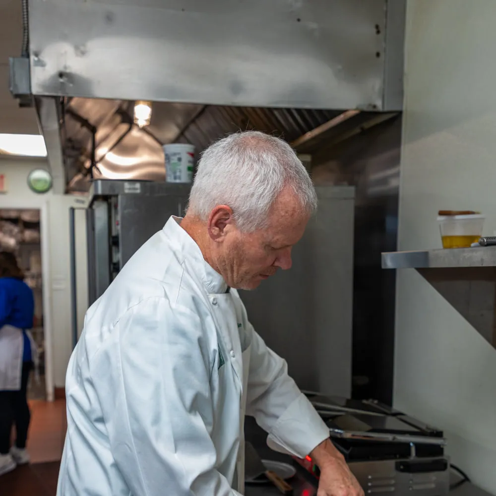 Chef Chris Coble working the line under the kitchen hood